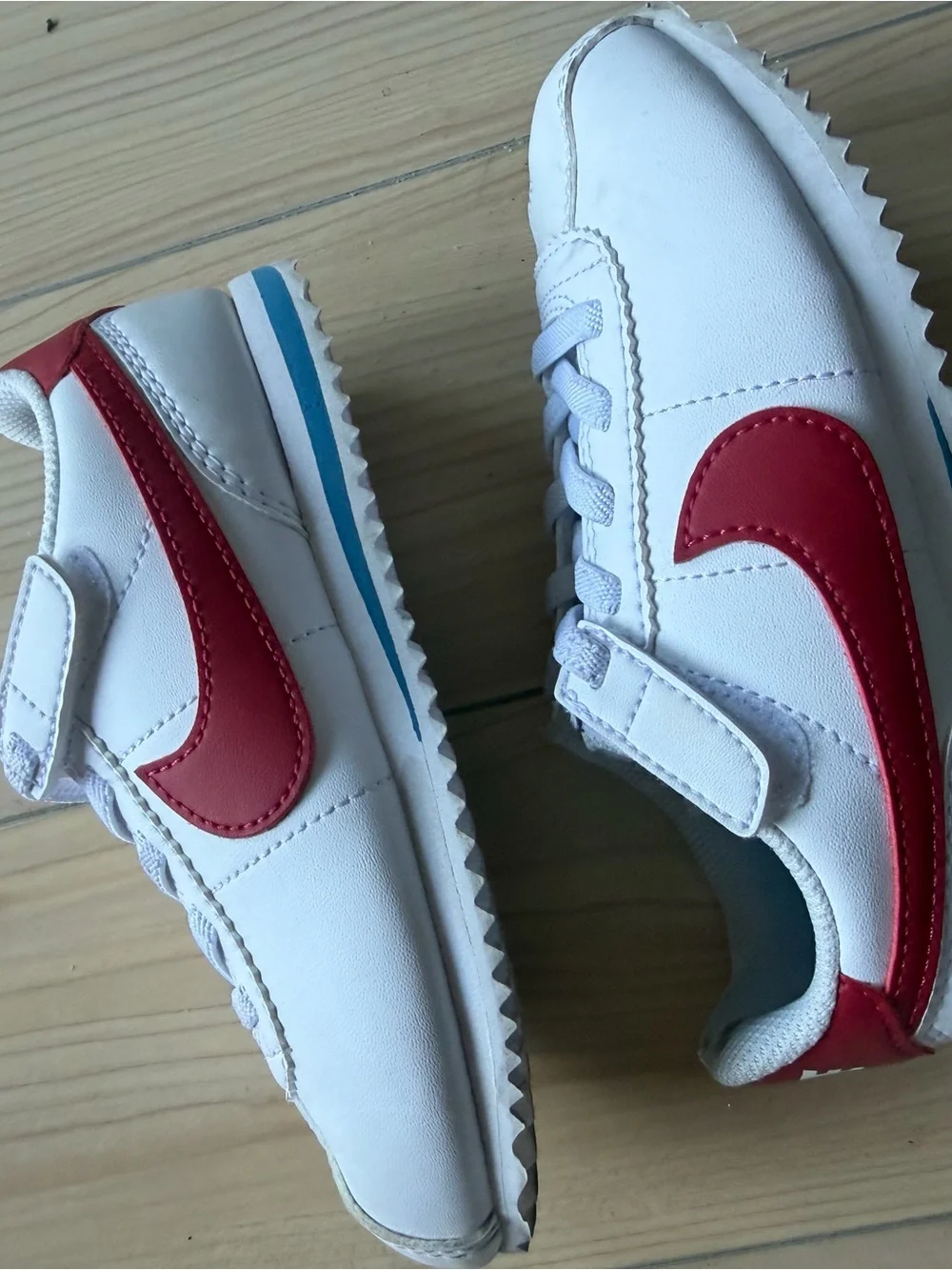 Nike Kids White Sneakers with Red Swoosh